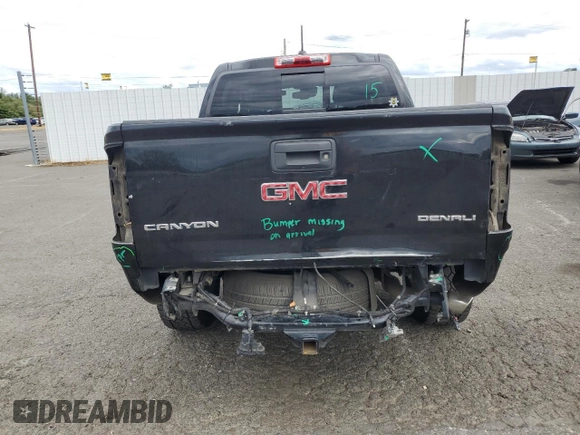 2020 GMC Canyon 4WD Denali with VIN 1GTG6EEN0L1243031, listed as a Copart auction lot 67939014 with 106,294 mi miles and Salvage Title. Bid and sale history available at carsss.com. Image 6.