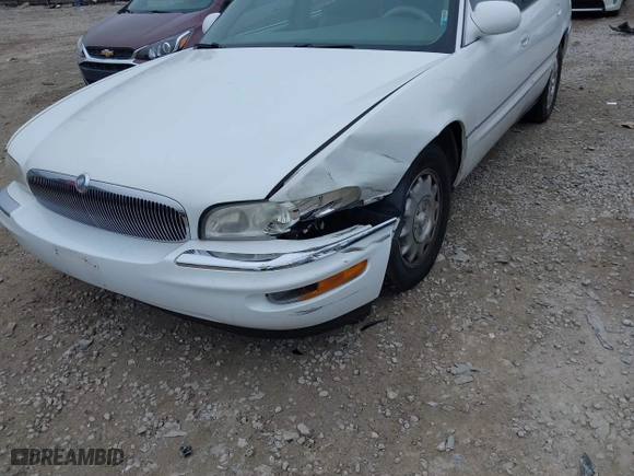 1999 Buick Park Avenue Ultra with VIN 1G4CU5217X4658627, listed as a IAAI auction lot 42013174 with 148,856 mi miles. Bid and sale history available at carsss.com. Image 6.
