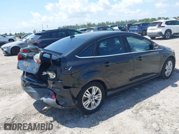 2012 Ford Focus SEL with VIN 1FAHP3H22CL146186, listed as a IAAI auction lot 41977207 with 127,396 mi miles. Bid and sale history available at carsss.com. Image 4.