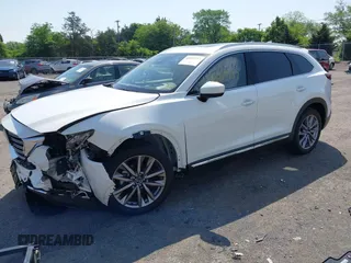 2021 Mazda CX-9 Grand Touring z VIN JM3TCBDY8M0537986, wystawiony jako IAAI lot #42267157 z przebiegiem 25 375 mil mil oraz . Historia ofert i sprzedaży dostępna na DreamBid. Obrazek 2.