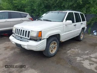 1997 Jeep Grand Cherokee Limited z VIN 1J4GZ78S1VC536295, wystawiony jako IAAI lot #42435292 z przebiegiem 310 005 mil mil oraz . Historia ofert i sprzedaży dostępna na DreamBid. Obrazek 18.
