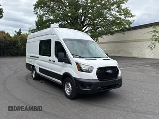 2021 Ford Transit Cargo with VIN 1FTBW3X87MKA60727, listed as a Copart auction lot 63123655 with 76,052 mi miles and Salvage title. Bid and sale history available at DreamBid. Image 1.