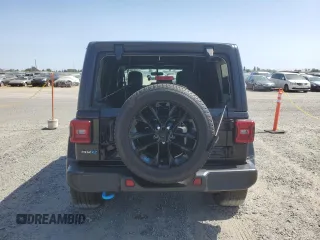 2023 Jeep Wrangler Sahara with VIN 1C4JJXP61PW512975, listed as a Copart auction lot 59392075 with 26,954 mi miles and Salvage title. Bid and sale history available at DreamBid. Image 6.