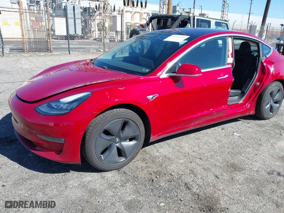 2018 Tesla Model 3 Long Range Battery with VIN 5YJ3E1EA6JF022061, listed as a IAAI auction lot 41602320 with 131,653 mi miles. Bid and sale history available at carsss.com. Image 17.