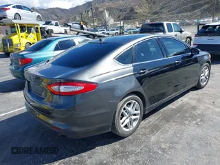 2015 Ford Fusion SE with VIN 3FA6P0H74FR185921, listed as a IAAI auction lot 41745943 with 143,083 mi miles. Bid and sale history available at carsss.com. Image 4.