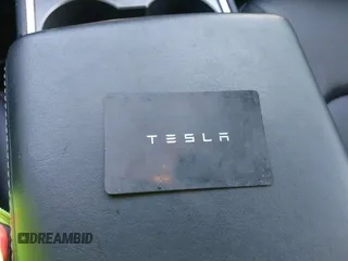 2022 Tesla Model Y Long Range with VIN 7SAYGAEE6NF361883, listed as a IAAI auction lot 41752441 with 50,493 mi miles and . Bid and sale history available at DreamBid. Image 11.