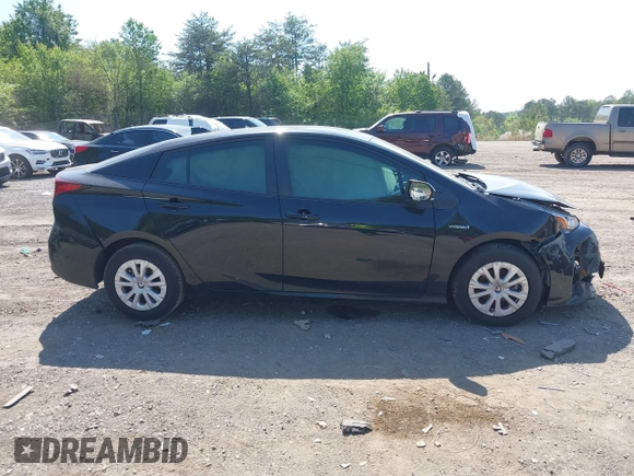 2022 Toyota Prius L Eco with VIN JTDKAMFU1N3182790, listed as a IAAI auction lot 41993264 with 124,777 mi miles and . Bid and sale history available at DreamBid. Image 12.