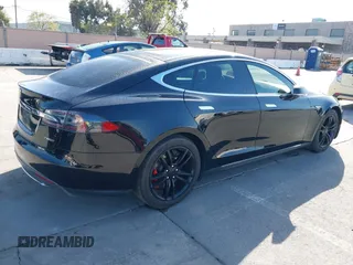 2014 Tesla Model S P85D with VIN 5YJSA1H22EFP65530, listed as a IAAI auction lot 41959941 with 76,532 mi miles and . Bid and sale history available at DreamBid. Image 4.