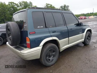 1997 Suzuki Sidekick z VIN JS3TD21V7V4109189, wystawiony jako IAAI lot #42526480 z przebiegiem 133 248 mil mil oraz . Historia ofert i sprzedaży dostępna na DreamBid. Obrazek 4.