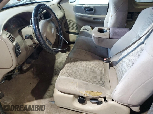 2003 Ford F-150 XL with VIN 1FTRX17283NA46215, listed as a Copart auction lot 85194094 with 168,415 mi miles and Salvage title. Bid and sale history available at DreamBid. Image 7.