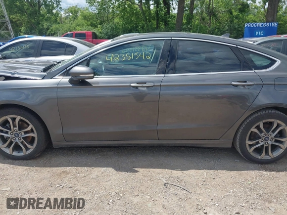 2020 Ford Fusion Titanium with VIN 3FA6P0RUXLR182120, listed as a IAAI auction lot 42351542 with 141,746 mi miles and . Bid and sale history available at DreamBid. Image 14.