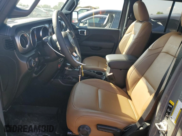 2023 Jeep Gladiator Rubicon with VIN 1C6JJTBG8PL550219, listed as a Copart auction lot 54627685 with 9,671 mi miles and Salvage title. Bid and sale history available at DreamBid. Image 7.