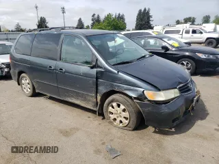 2003 Honda Odyssey EX-L z VIN 5FNRL18053B123100, wystawiony jako Copart lot #54159715 z przebiegiem 232 206 mil mil oraz Szkoda całkowita • Salvage title. Historia ofert i sprzedaży dostępna na DreamBid. Obrazek 4.