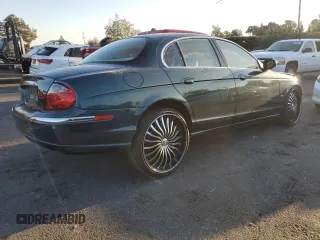 2003 Jaguar S-Type z VIN SAJEA01U73HM48330, wystawiony jako Copart lot #80128574 z przebiegiem Nie podano mil oraz Szkody całkowita. Historia ofert i sprzedaży dostępna na DreamBid. Obrazek 3.