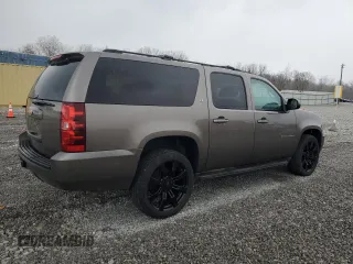 2013 Chevrolet Suburban LT with VIN 1GNSKJE77DR131188, listed as a Copart auction lot 52880375 with 147,278 mi miles and Salvage Title. Bid and sale history available at DreamBid. Image 3.