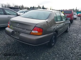 1999 Nissan Altima XE with VIN 1N4DL01D1XC210017, listed as a IAAI auction lot 41199544 with 297,917 mi miles. Bid and sale history available at carsss.com. Image 4.