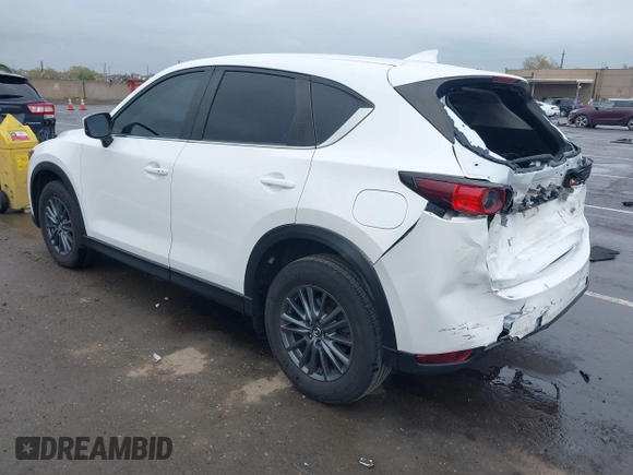 2020 Mazda CX-5 Touring with VIN JM3KFACM0L0738615, listed as a IAAI auction lot 41923923 with 52,599 mi miles. Bid and sale history available at carsss.com. Image 3.