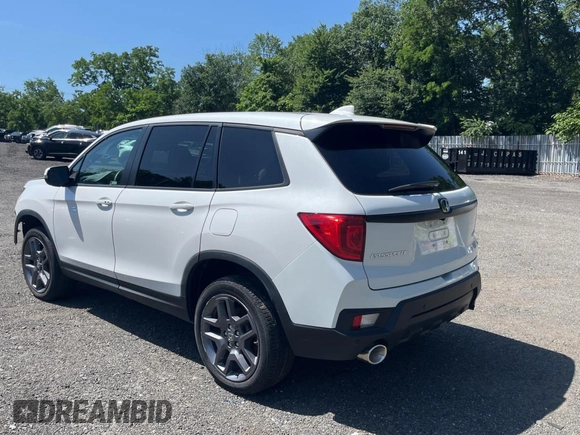 2023 Honda Passport EX-L with VIN 5FNYF8H55PB011474, listed as a Copart auction lot 62492595 with 18,327 mi miles and Salvage title. Bid and sale history available at DreamBid. Image 3.
