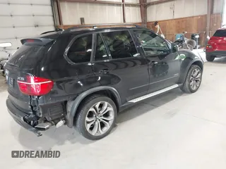2012 BMW X5 50i with VIN 5UXZV8C50CL425721, listed as a IAAI auction lot 42590676 with 192,355 mi miles and . Bid and sale history available at DreamBid. Image 4.