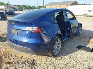 2023 Tesla Model Y Long Range with VIN 7SAYGDEE3PA114256, listed as a IAAI auction lot 42158307 with 19,975 mi miles and . Bid and sale history available at DreamBid. Image 4.