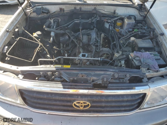 1999 Toyota Land Cruiser with VIN JT3HT05J0X0059222, listed as a Copart auction lot 77713294 with 406,869 mi miles and Clean Title. Bid and sale history available at carsss.com. Image 11.