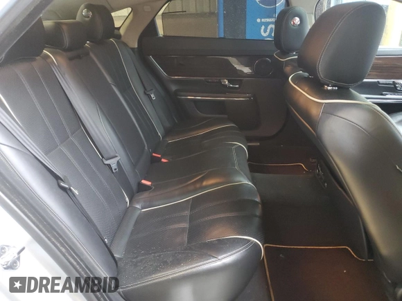 2013 Jaguar XJ Portfolio z VIN SAJWJ2GD6D8V44717, wystawiony jako Copart lot #52340635 z przebiegiem 120 560 mil mil oraz Szkody całkowita. Historia ofert i sprzedaży dostępna na DreamBid. Obrazek 10.