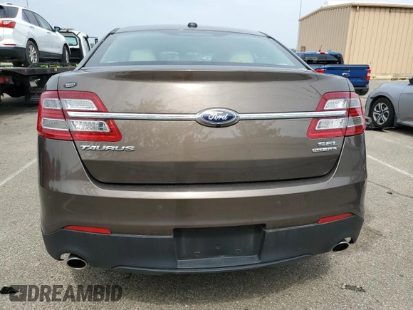 2015 Ford Taurus SEL with VIN 1FAHP2E89FG193926, listed as a Copart auction lot 61036375 with 23,963 mi miles and Salvage title. Bid and sale history available at DreamBid. Image 6.
