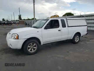 2002 Nissan Frontier z VIN 1N6DD26S32C345225, wystawiony jako Copart lot #55897695 z przebiegiem 102 680 mil mil oraz Czysty tytuł • Clean title. Historia ofert i sprzedaży dostępna na DreamBid. Obrazek 1.