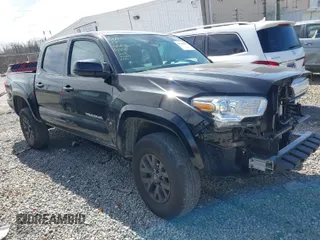 2023 Toyota Tacoma 4WD SR with VIN 3TMCZ5AN6PM594451, listed as a IAAI auction lot 41740487 with 47,671 mi miles. Bid and sale history available at carsss.com. Image 1.