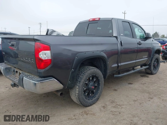 2014 Toyota Tundra SR with VIN 5TFUM5F16EX052444, listed as a IAAI auction lot 42298372 with 121,876 mi miles and . Bid and sale history available at DreamBid. Image 4.