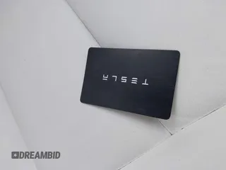 2018 Tesla Model 3 Long Range Battery with VIN 5YJ3E1EB9JF097118, listed as a IAAI auction lot 41619510 with 64,132 mi miles and . Bid and sale history available at DreamBid. Image 11.