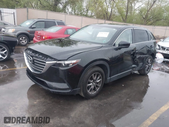 2016 Mazda CX-9 Touring with VIN JM3TCBCY5G0101490, listed as a IAAI auction lot 42062846 with 85,352 mi miles and . Bid and sale history available at DreamBid. Image 2.