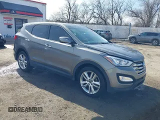 2013 Hyundai Santa Fe Sport z VIN 5XYZWDLA1DG003779, wystawiony jako IAAI lot #41761431 z przebiegiem 127 895 mil mil oraz . Historia ofert i sprzedaży dostępna na DreamBid. Obrazek 1.
