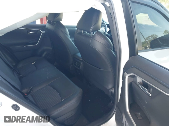 2021 Toyota RAV4 Hybrid XSE with VIN 2T3E6RFV9MW019837, listed as a IAAI auction lot 42002574 with 74,214 mi miles. Bid and sale history available at carsss.com. Image 8.