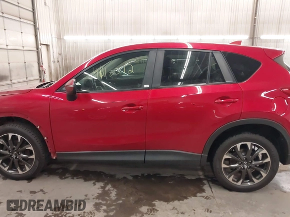 2016 Mazda CX-5 Grand Touring with VIN JM3KE4DY7G0731057, listed as a IAAI auction lot 41118072 with 134,107 mi miles and . Bid and sale history available at carsss.com. Image 15.