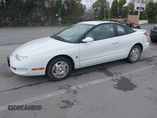 1999 Saturn SC with VIN 1G8ZY1271XZ276834, listed as a IAAI auction lot 41445985 with 62,428 mi miles. Bid and sale history available at carsss.com. Image 2.