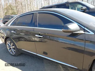 2013 Cadillac XTS Luxury z VIN 2G61R5S33D9184878, wystawiony jako IAAI lot #41644213 z przebiegiem 113 293 mil mil oraz . Historia ofert i sprzedaży dostępna na DreamBid. Obrazek 13.