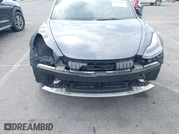 2023 Tesla Model 3 with VIN 5YJ3E1EA4PF410060, listed as a IAAI auction lot 42067624 with 59,934 mi miles and . Bid and sale history available at DreamBid. Image 6.
