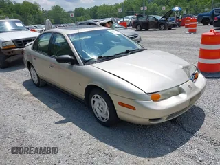 2001 Saturn SL z VIN 1G8ZK54721Z272773, wystawiony jako IAAI lot #42449133 z przebiegiem 56 714 mil mil oraz . Historia ofert i sprzedaży dostępna na DreamBid. Obrazek 1.