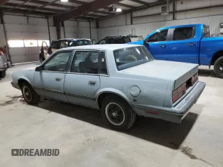 1985 Chevrolet Celebrity z VIN 2G1AW19X2F1138184, wystawiony jako Copart lot #82756234 z przebiegiem 11 872 mil mil oraz Tytuł czysty. Historia ofert i sprzedaży dostępna na DreamBid. Obrazek 2.
