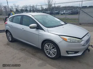 2015 Ford Focus Titanium with VIN 1FADP3N27FL228549, listed as a IAAI auction lot 41912941 with 69,025 mi miles. Bid and sale history available at carsss.com. Image 1.