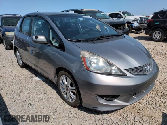 2010 Honda Fit Sport with VIN JHMGE8H41AC002070, listed as a Copart auction lot 62356565 with 148,279 mi miles and Salvage title. Bid and sale history available at DreamBid. Image 13.