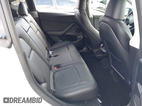 2023 Tesla Model Y Long Range with VIN 7SAYGDEE7PF832007, listed as a IAAI auction lot 41751598 with 14,126 mi miles and . Bid and sale history available at DreamBid. Image 8.