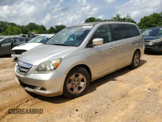 2006 Honda Odyssey EX-L z VIN 5FNRL387X6B458818, wystawiony jako Copart lot #61801335 z przebiegiem 227 179 mil mil oraz Czysty tytuł • Clean title. Historia ofert i sprzedaży dostępna na DreamBid. Obrazek 1.