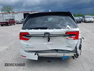 2023 Honda Odyssey Touring with VIN 5FNRL6H88PB079716, listed as a IAAI auction lot 42208628 with 26,679 mi miles and . Bid and sale history available at DreamBid. Image 6.