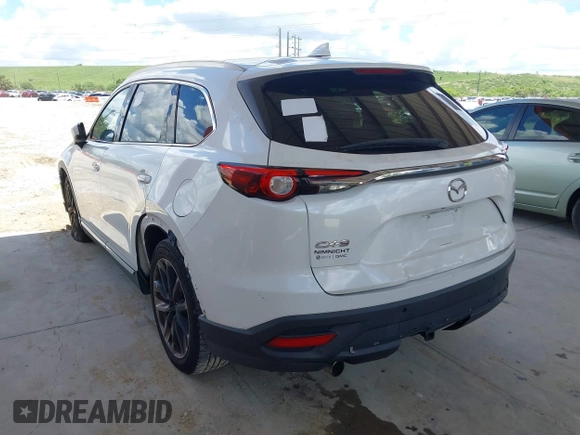 2016 Mazda CX-9 Grand Touring with VIN JM3TCADYXG0113563, listed as a IAAI auction lot 42593120 with 237,696 mi miles and . Bid and sale history available at DreamBid. Image 3.