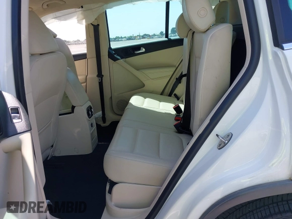 2014 Volkswagen Tiguan SEL with VIN WVGAV3AX9EW512956, listed as a IAAI auction lot 42110002 with 136,034 mi miles and . Bid and sale history available at DreamBid. Image 8.