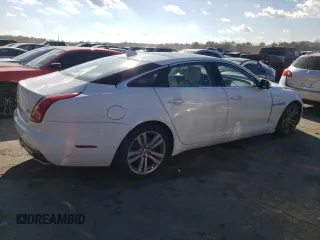 2017 Jaguar XJ with VIN SAJWJ2GD4H8W12163, listed as a Copart auction lot 86993064 with 63,697 mi miles and Salvage Title. Bid and sale history available at carsss.com. Image 3.