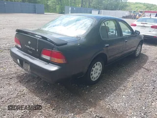 1998 Nissan Maxima GXE with VIN JN1CA21D2WM923835, listed as a IAAI auction lot 42221419 with 256,441 mi miles and . Bid and sale history available at DreamBid. Image 4.