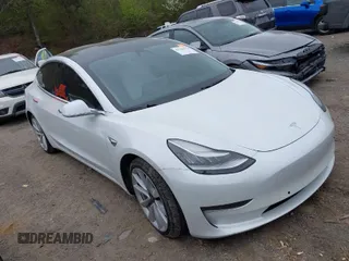 2020 Tesla Model 3 Long Range with VIN 5YJ3E1EB0LF703733, listed as a IAAI auction lot 41796732 with 75,027 mi miles. Bid and sale history available at carsss.com. Image 1.